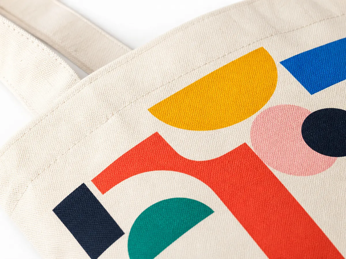 DTF custom bag printing result — canvas tote bag with vibrant opaque geometric design
