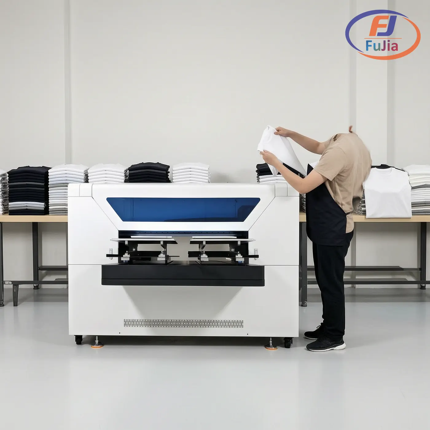 High-volume DTG production bay with garment loading and curing on a factory floor
